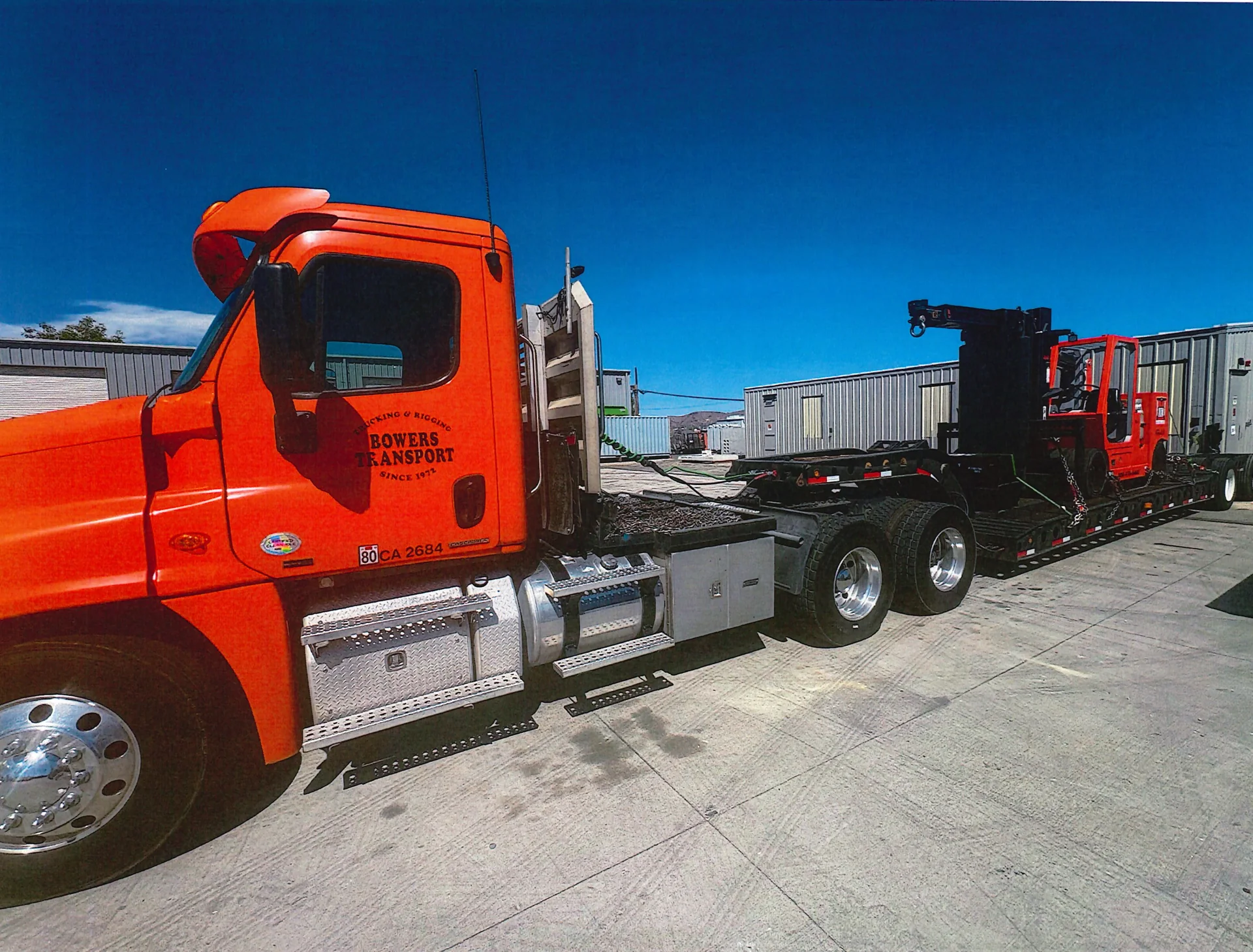 Orange Bowers Transport truck with the company name on its door